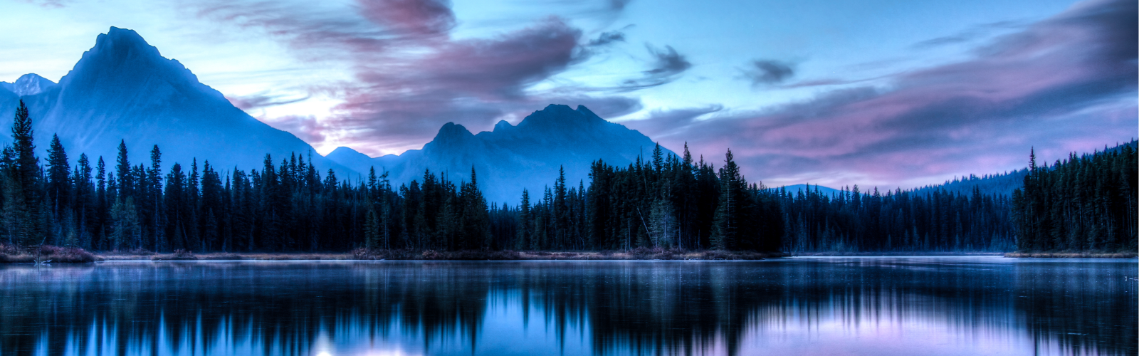 Calm mountain and lake landscape at dusk