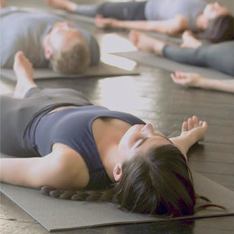 Woman laying down in yoga class