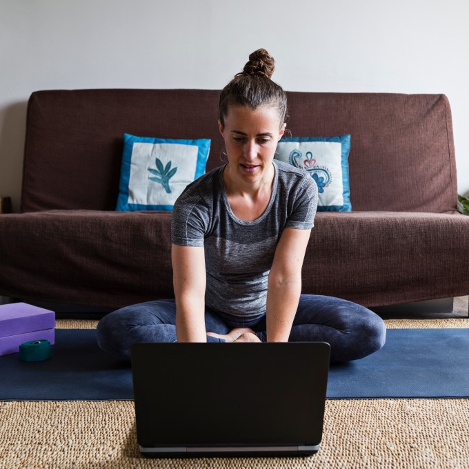 Woman sitting on the floor with laptop